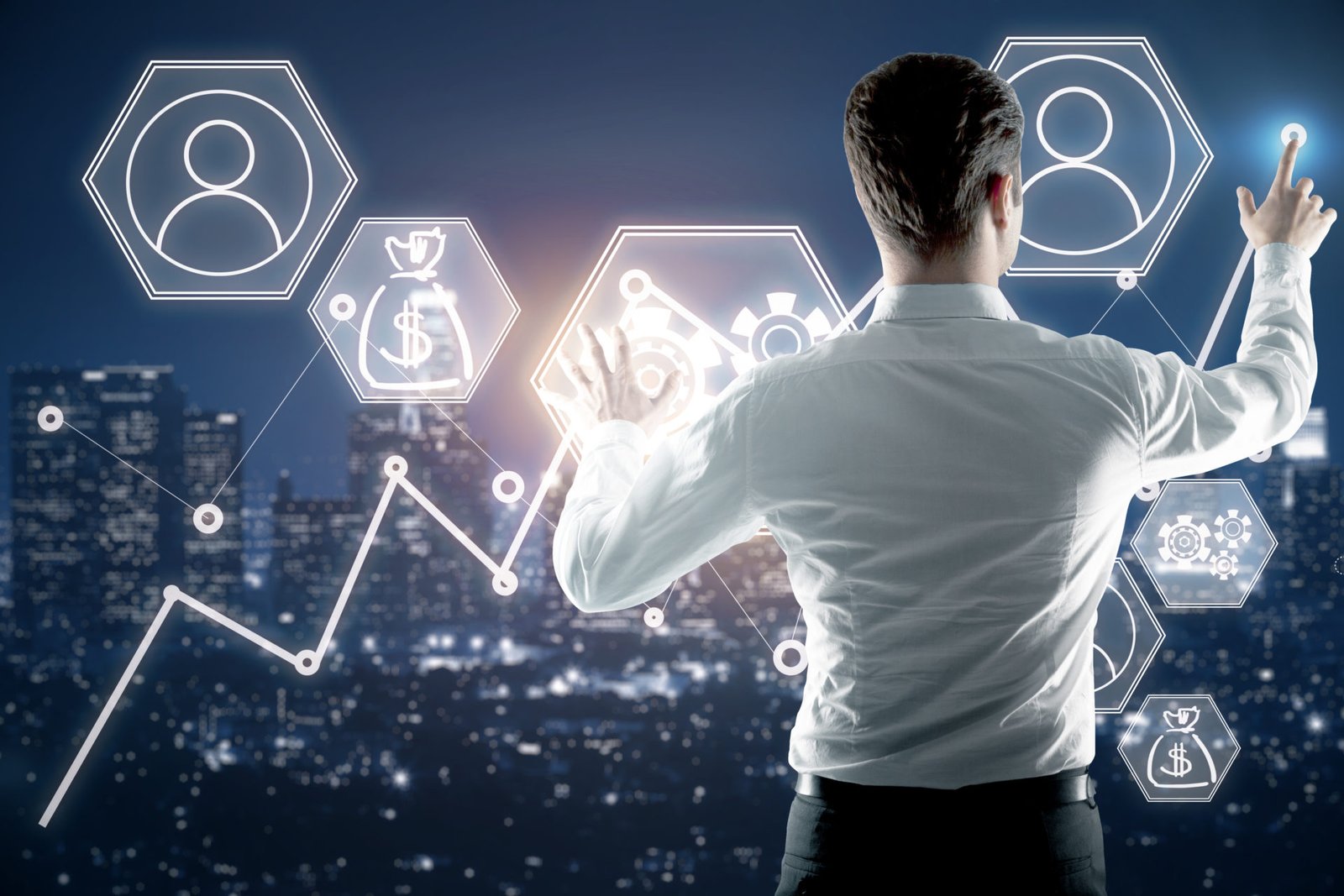 Back view of young businessman managing abstract business screen on night city background. Fund management concept